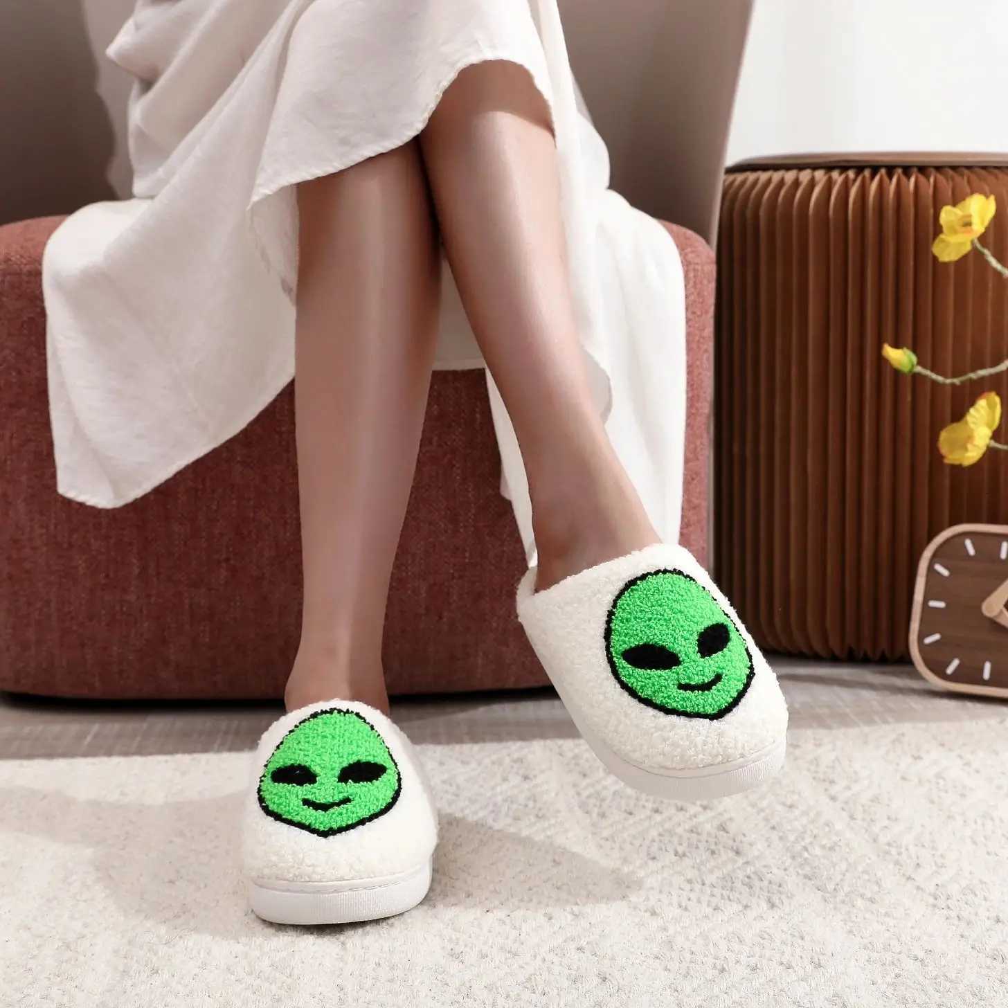 A pair of alien patterned winter home cotton slippers non-slip thick-soled wool slippers comfortable indoor shoes for men and women can wear S260305