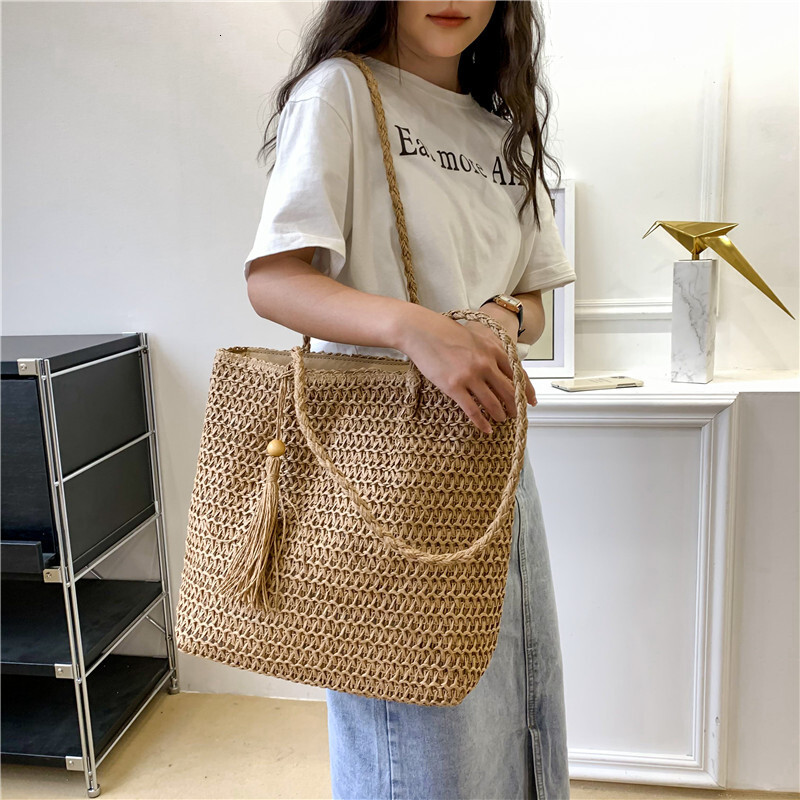 Beach vacation style women's large bag new hollow straw tote bag spring and summer large capacity armpit beach bag designer bag