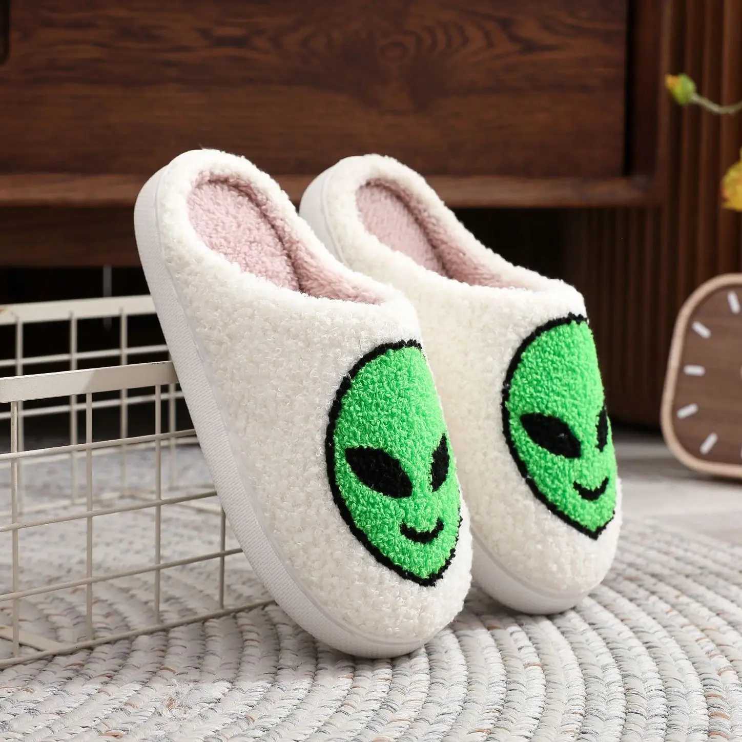 A pair of alien patterned winter home cotton slippers non-slip thick-soled wool slippers comfortable indoor shoes for men and women can wear S260305