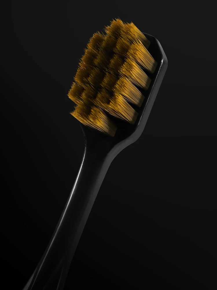 This 6-piece gift box set of black and gold toothbrushes features printed handles and soft bristles, making it ideal for adults, couples, home use, an