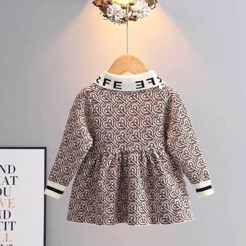 This girls' heart letter knitted dress is Korean-style, luxurious, and sweet, making it a perfect long-sleeve princess dress with a bow for autum