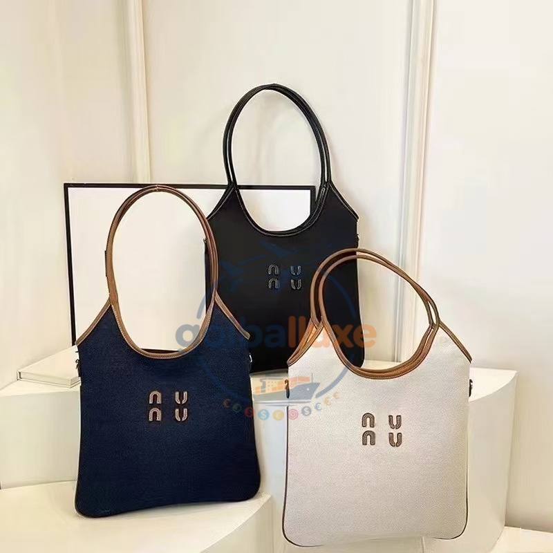 A luxurious designer lady's crossbody handbag, tote bag or shoulder bag, is fully hand-sewn. It features classic and fashionable leather material and canvas shopping bag.