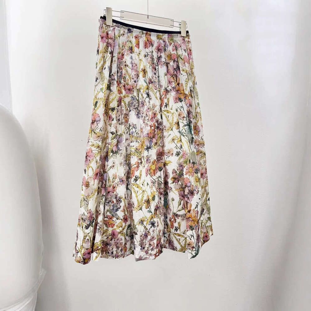 The 2026 Spring and Summer New Collection features a colorful floral cotton chiffon pleated skirt for women