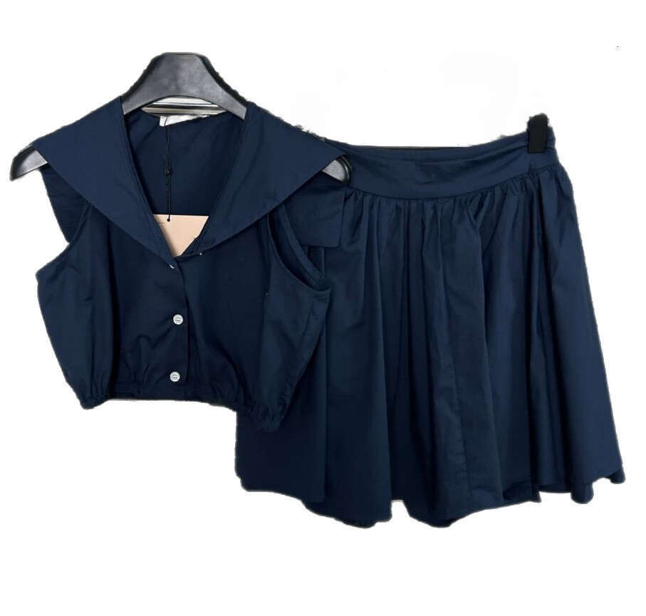 2026 new retro style slim fit bright navy blue sleeveless dress paired with a back waist tie and sexy short skirt