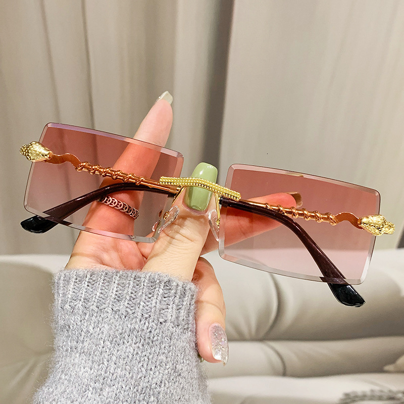 2026 New Designer Luxury Brand Fashion Personality INS Serpentine Frameless Sunglasses Outdoor Driving Fashion Street Style Value Sunglasses