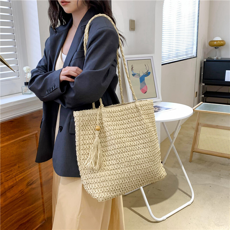 Beach vacation style women's large bag new hollow straw tote bag spring and summer large capacity armpit beach bag designer bag