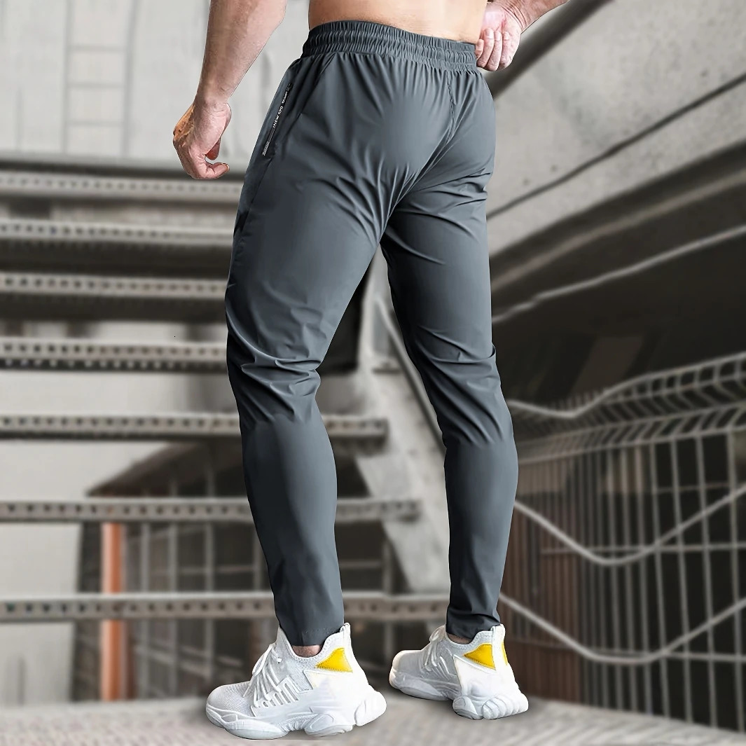 Men High Elasticity Ice Silky Joggers with Zipper Pockets Breathable Stretchy Athletic Pants for Running Gym and Outdoor Activit 260306