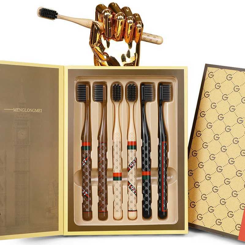 This 6-piece luxury monogram soft bristle toothbrush set with a comfortable handle is ideal for unisex adults in daily home oral care.T260307