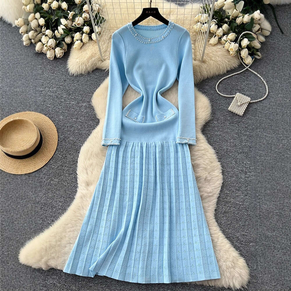 2026 European and American French style new women's clothing elegant autumn and winter long sleeved knitted dress waist A-line sweater long skirt