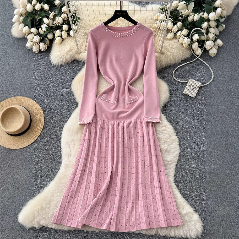2026 European and American French style new women's clothing elegant autumn and winter long sleeved knitted dress waist A-line sweater long skirt