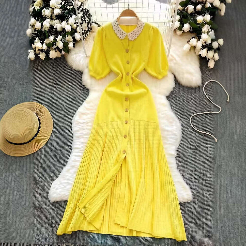 French elegant knitted women's summer single breasted pleated designer's unique and chic long skirt 2026