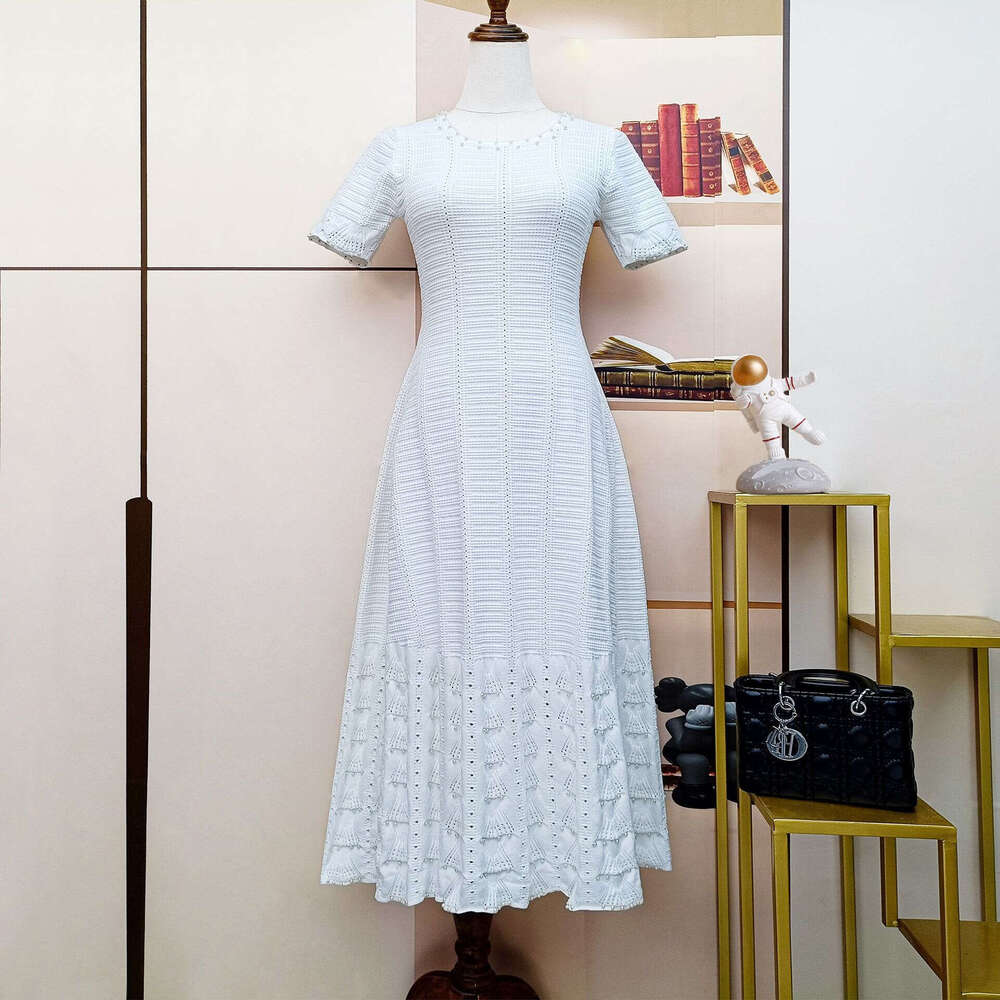 2026 designer French women's fashion summer new short sleeved knitted hollow slimming A-line dress