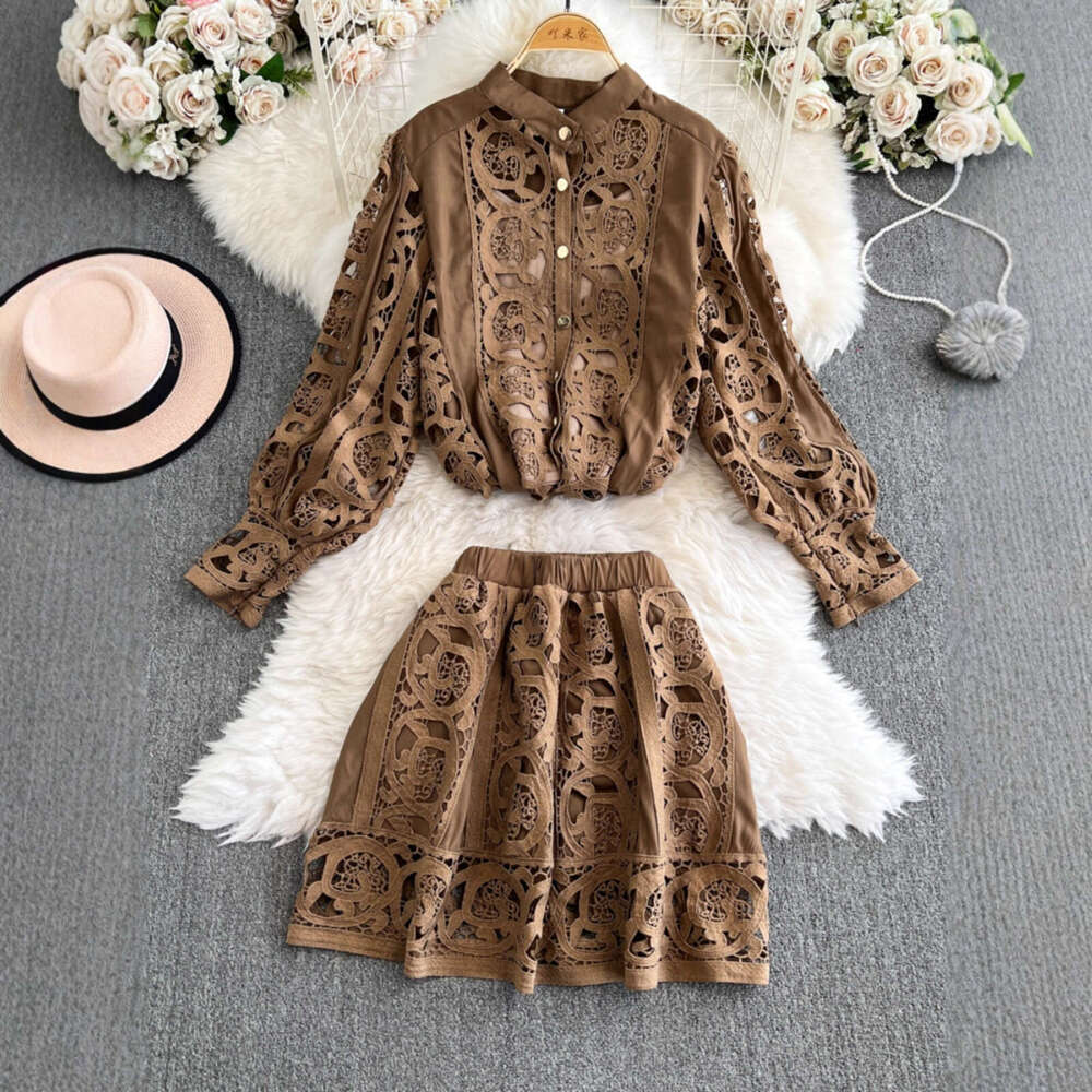 Designer's palace style heavy embroidery hollow out long sleeved shirt top and high waisted short skirt fashionable casual lace