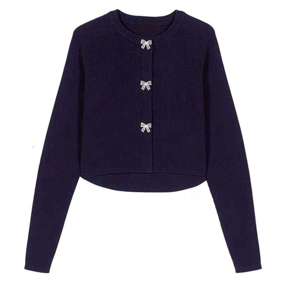 The new women's clothing for the spring and autumn of 2026 adopts a soft knitted cardigan bow and button decoration round neck design