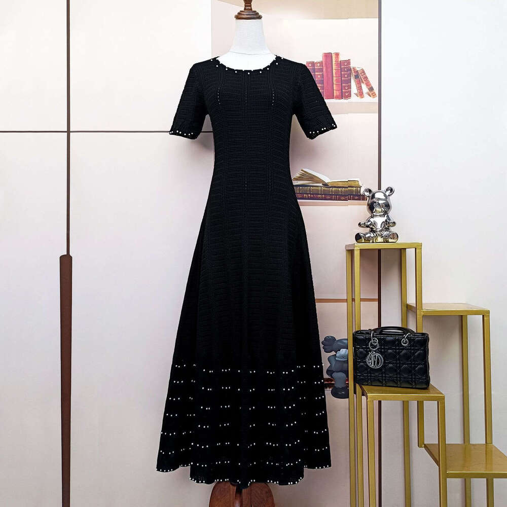 2026 designer French women's fashion summer new short sleeved knitted hollow slimming A-line dress