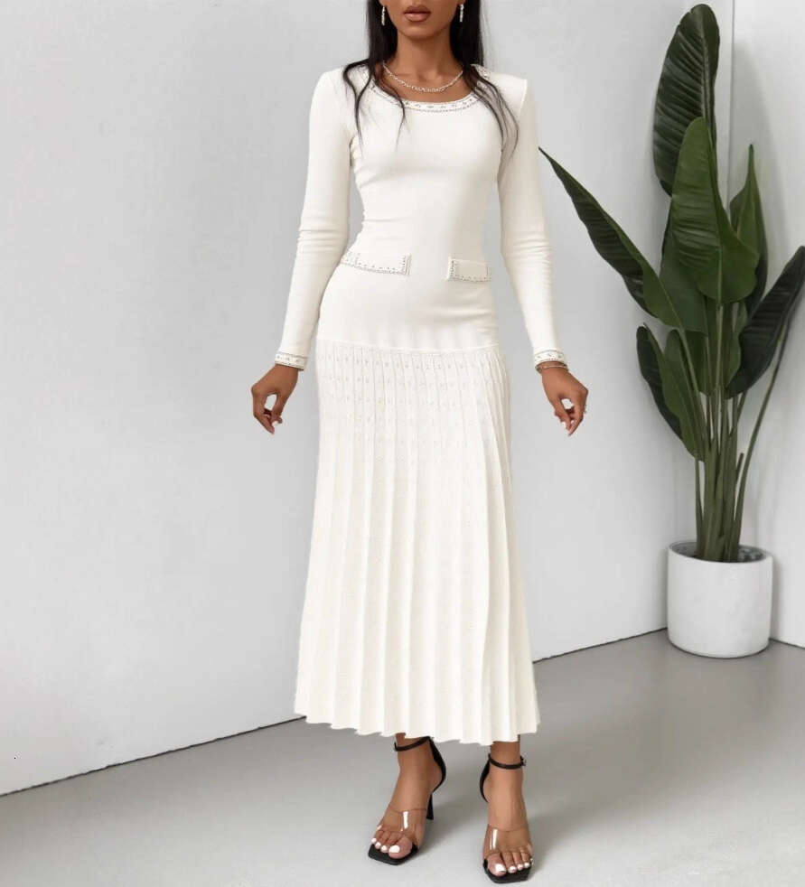 2026 European and American French style new women's clothing elegant autumn and winter long sleeved knitted dress waist A-line sweater long skirt