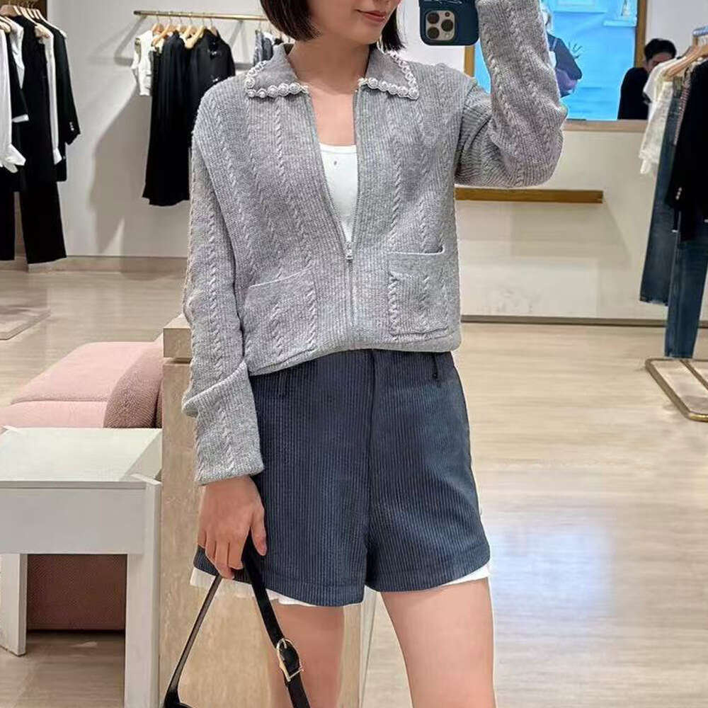 2026 autumn and winter new women's pearl embellished lapel gray elegant temperament commuting short knitted cardigan