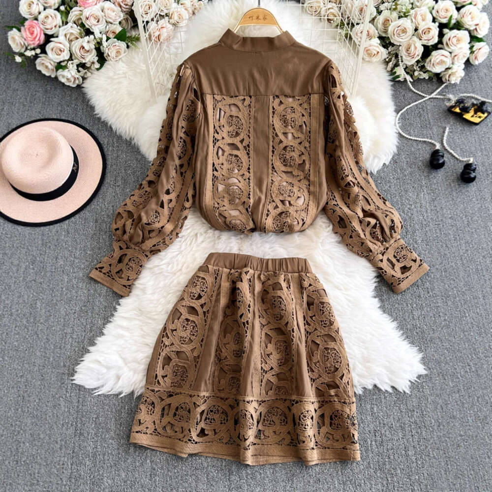 Designer's palace style heavy embroidery hollow out long sleeved shirt top and high waisted short skirt fashionable casual lace