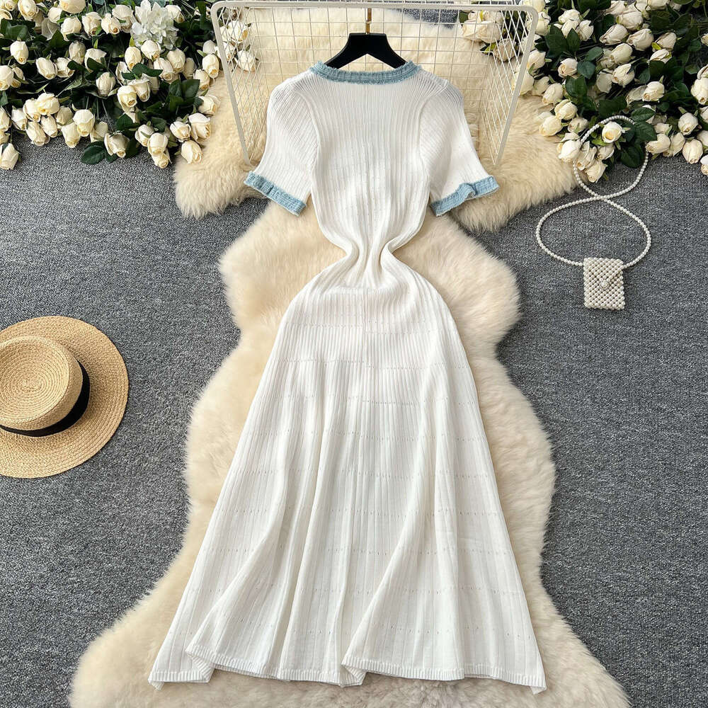 2026 designer's fashionable elegant denim patchwork dress with short sleeves, waist cinching, and knitted long sleeves