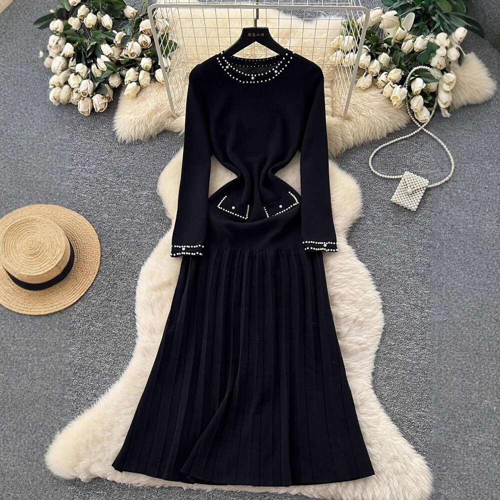 2026 European and American French style new women's clothing elegant autumn and winter long sleeved knitted dress waist A-line sweater long skirt