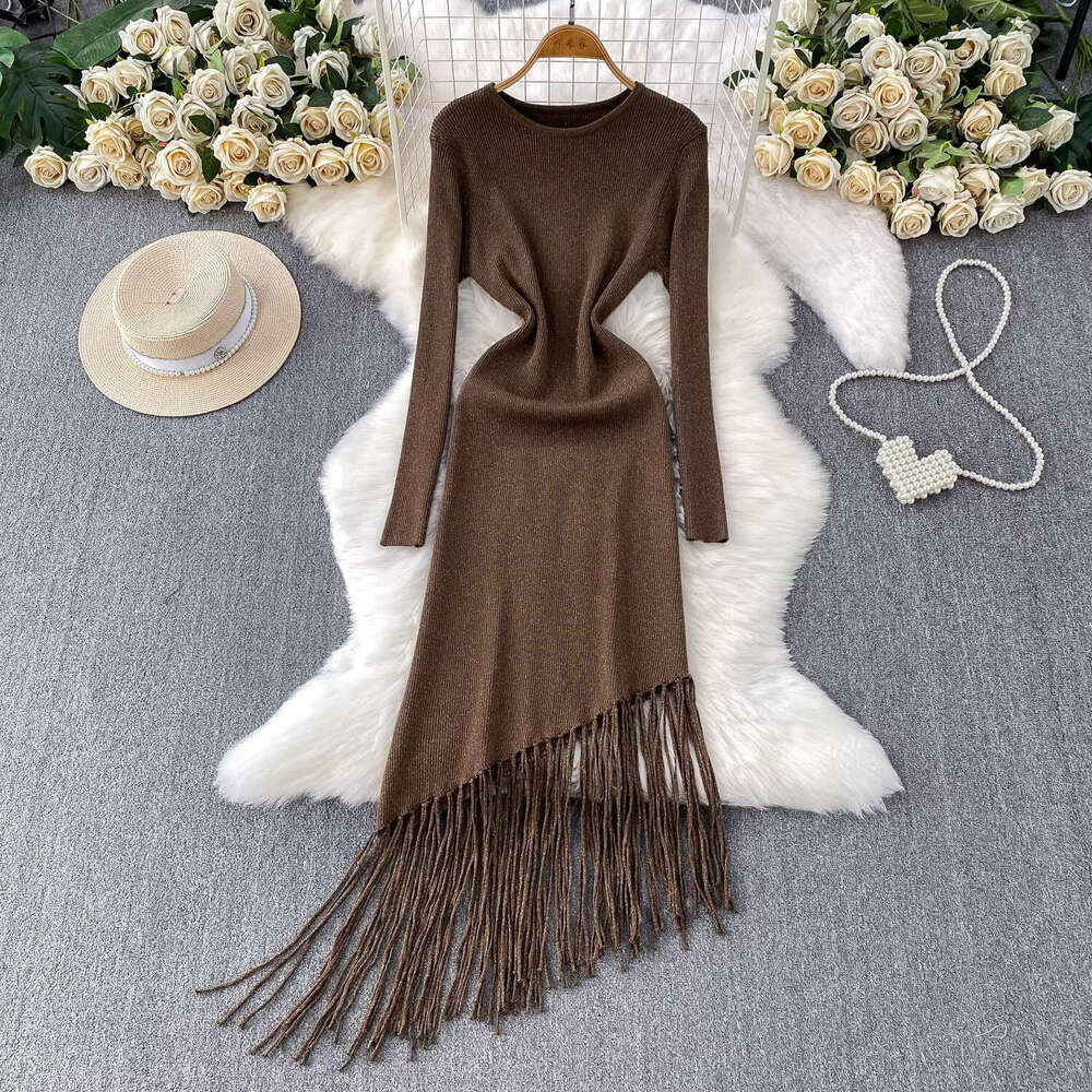 Elegant and delicate shiny silk knitted long sleeved women's 2026 French style new asymmetrical elegant tassel dress