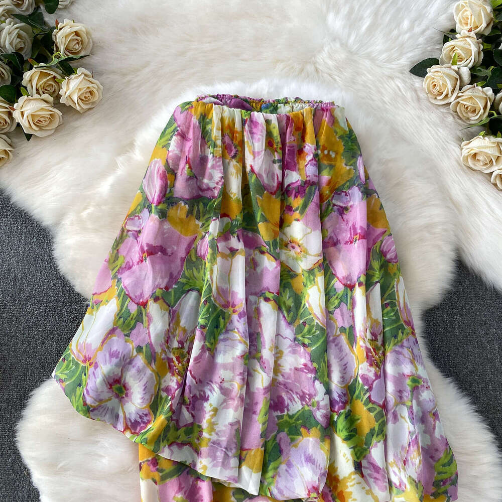 Vintage French vacation style charming and elegant women's printed strapless dress paired with a niche elegant cape