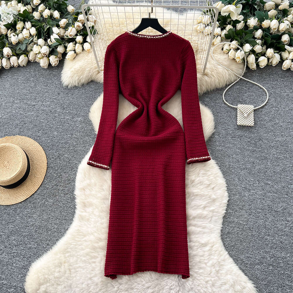 Women's dress 2026 autumn and winter French high-end style metal button waist slimming elegant knitted fabric