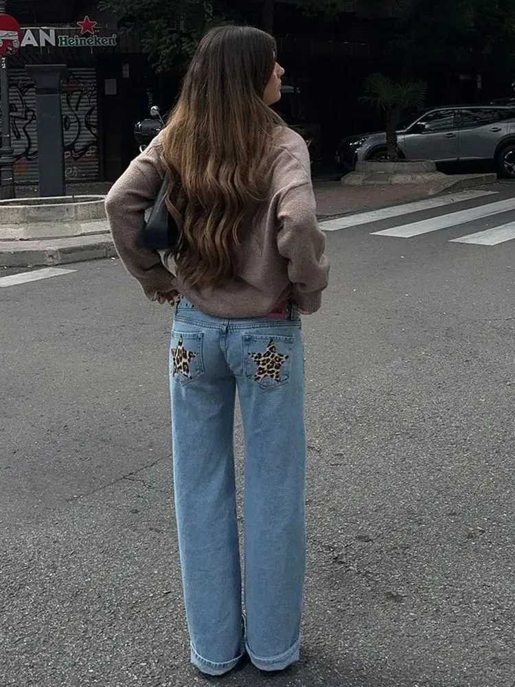 The streetwear gothic wide leg jeans for women showcase a mid-rise fit, Y2K retro design, and eye-catching sequin leopard star and rivet accents.T2603