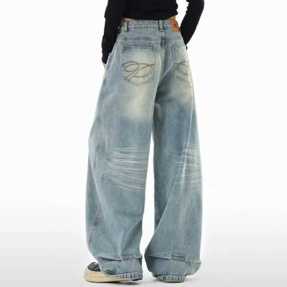 Relaxing high waisted curved knife jeans for womens spring and autumn new trend American loose wide leg mopping jeans trend M260310