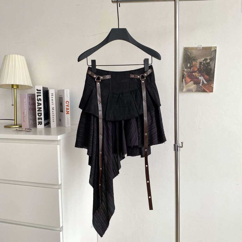 Design a niche multifunctional women's irregular skirt in 2026 autumn and winter, featuring an American retro style with a belt and ruffles