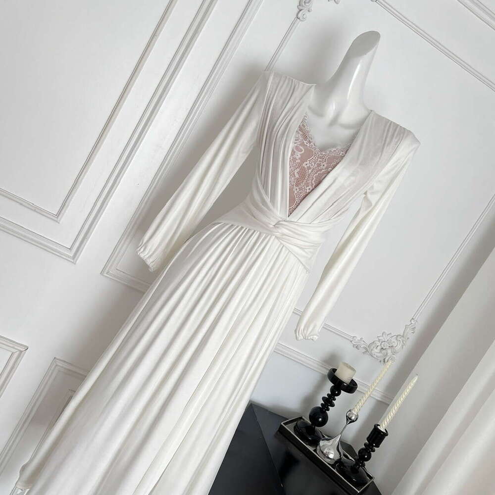 2026 French elegant and sexy V-neck lace patchwork long sleeved dress with fashionable twisted design and waistband effect