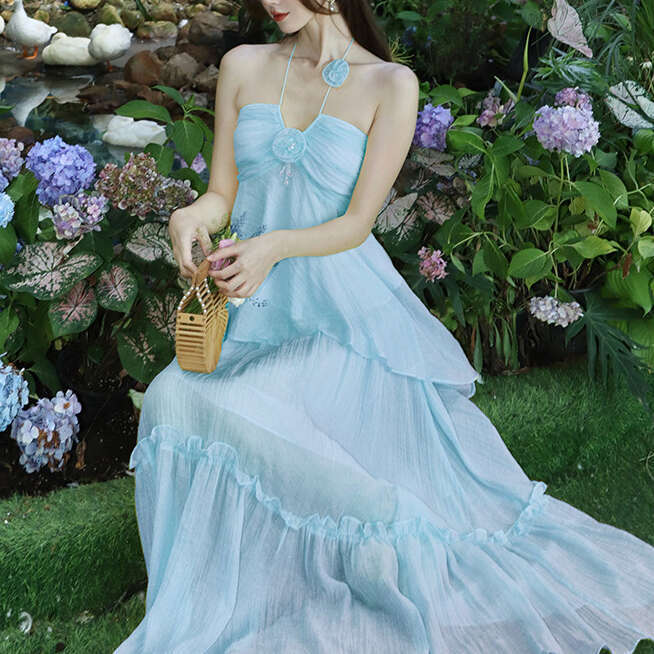 2026 designer niche design high-end tea break French chic style seaside vacation yellow camisole skirt