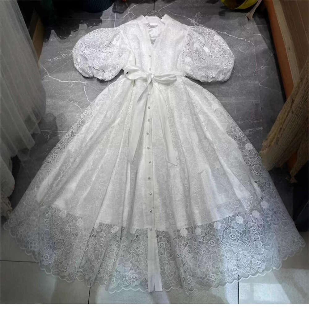 2026 new European and American niche retro palace style goddess simple solid color lantern sleeves loose lace up cardigan long skirt