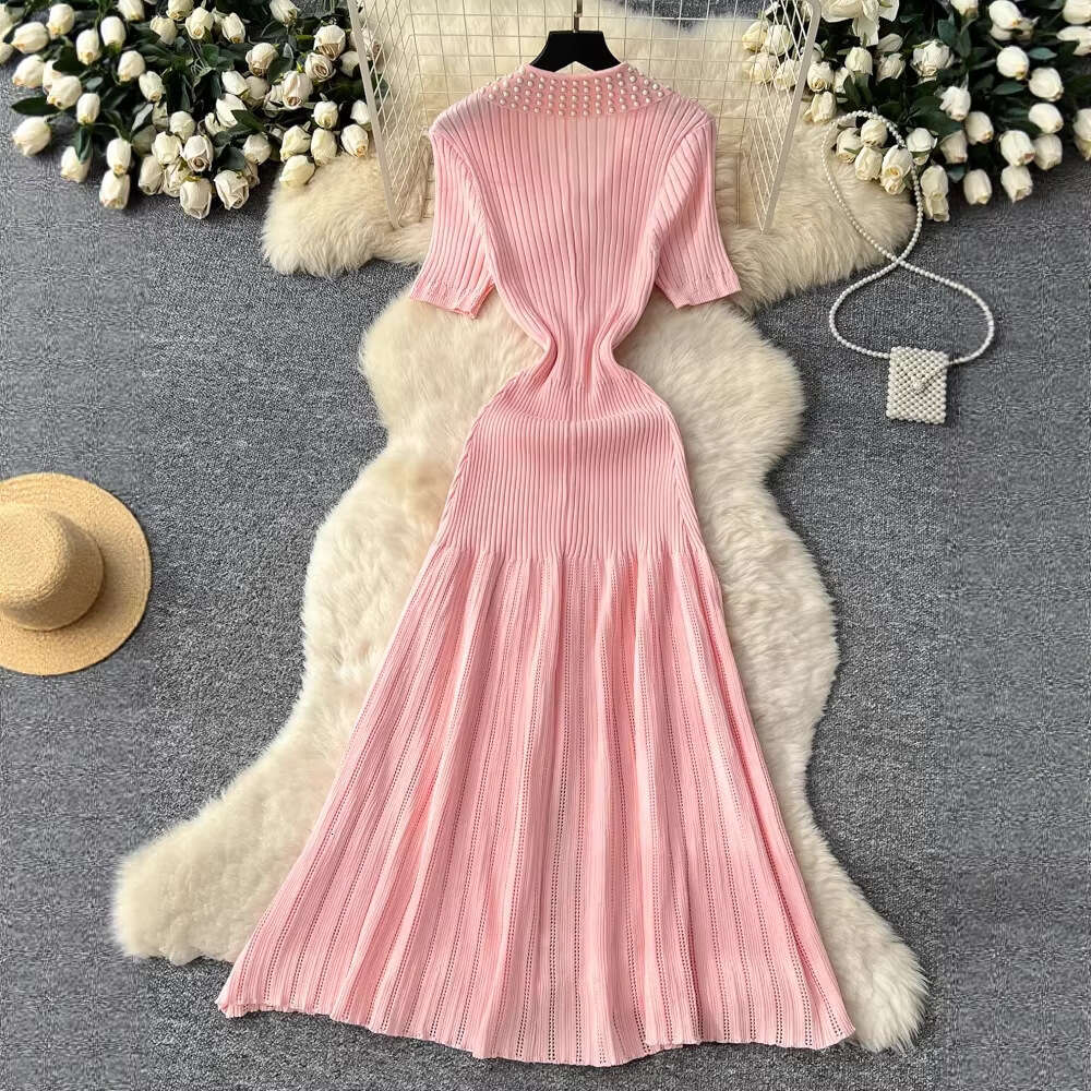 2026 vintage Hepburn style bead embellishment lapel knit women's autumn and winter single breasted waist with elegant fishtail long skirt