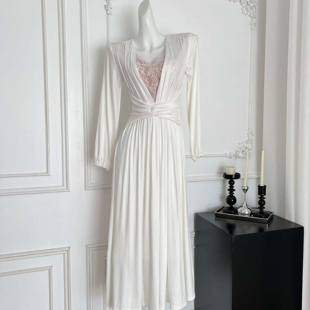 2026 French elegant and sexy V-neck lace patchwork long sleeved dress with fashionable twisted design and waistband effect