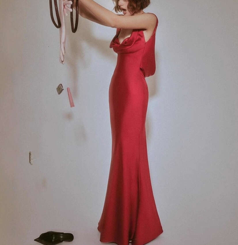 2026 new women's niche design social goddess sexy shoulder strap fake two-piece chest slimming tight mermaid long skirt