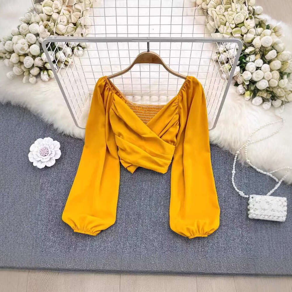 Spring fashion V-neck pleated collarbone exposed fluffy long sleeved pullover for women's fashionable and unique short top