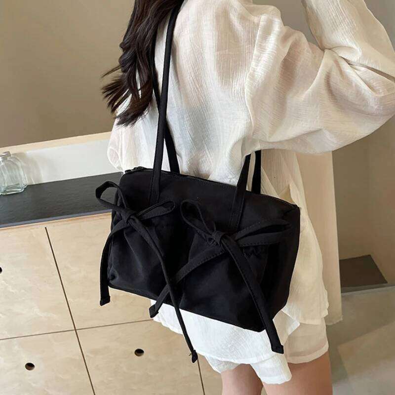 2026 New Korean Bow Nylon Shoulder Fashionable and Sweet Design Tote Bag Folded Large Capacity Commuter Women's Handbag XJ260311