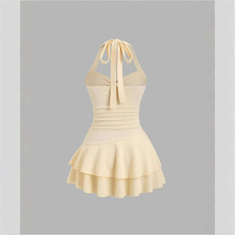 Women's elegant textured fabric mini dress with halter neck tie, ruched bust, and metal embellishments