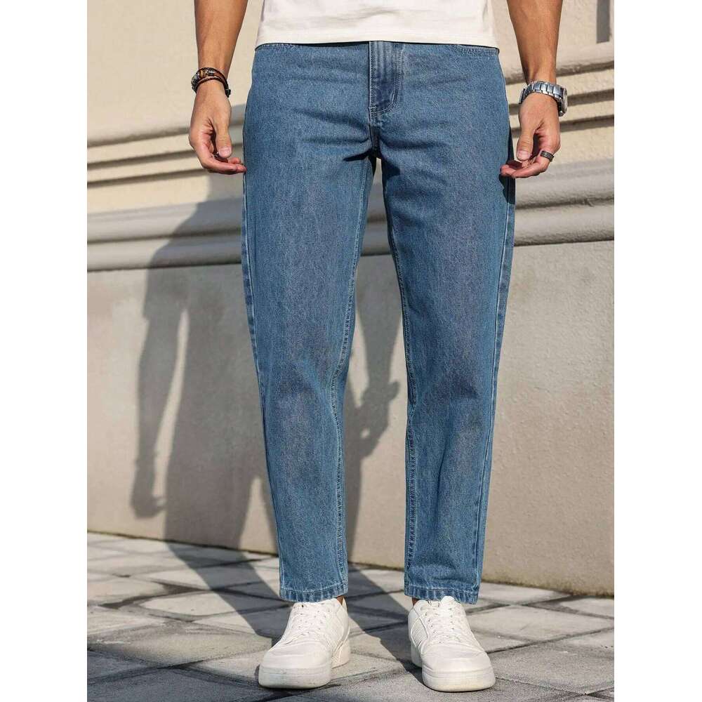 Men's jeans are made of classic blue denim fabric with a loose fit, making them an indispensable versatile item in the wardrobe.