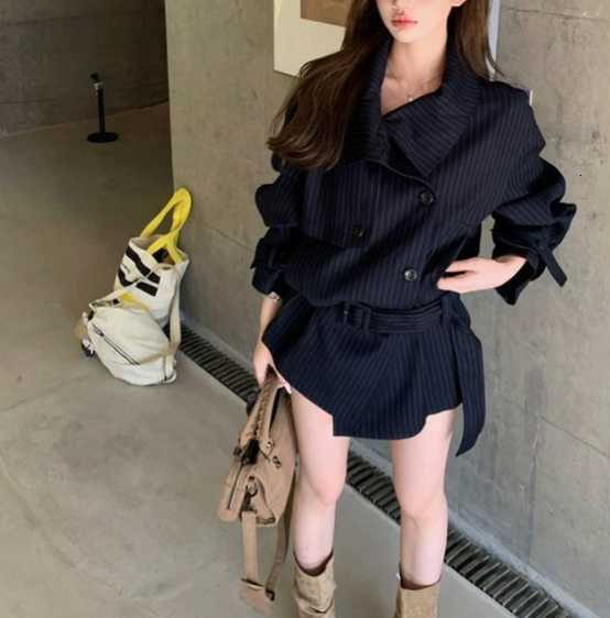 Striped V-neck trench coat for women in autumn 2026 - a new style with high-end feel, loose and elegant mid-length top. H260312