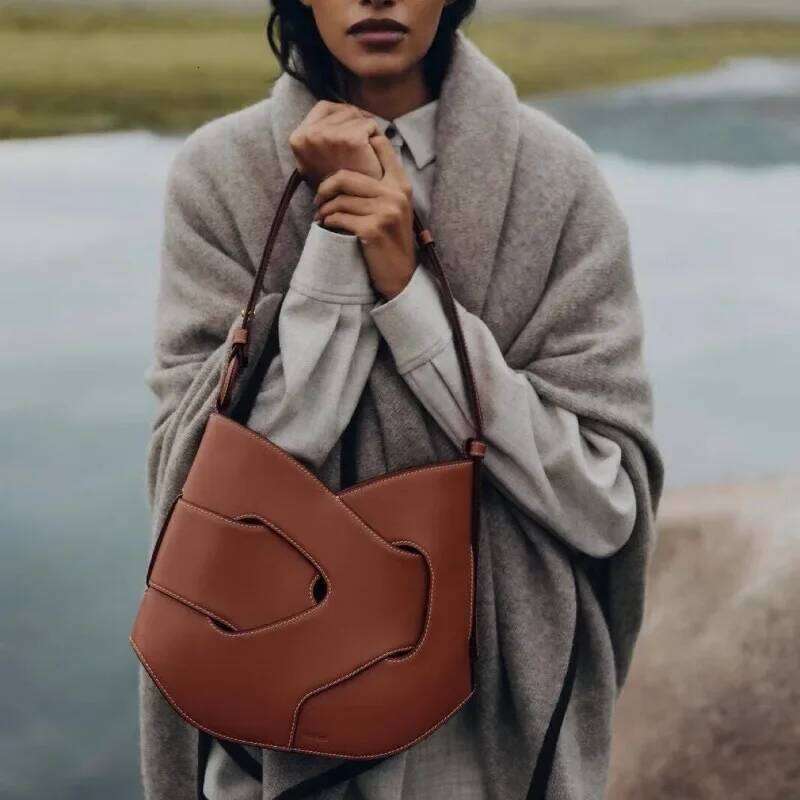 New Smooth Cowhide Twisted Handheld Crossbody Bag Trendy XIU LAI SI