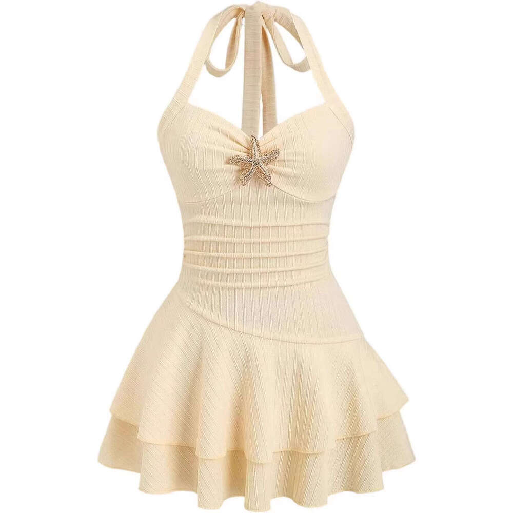 Women's elegant textured fabric mini dress with halter neck tie, ruched bust, and metal embellishments