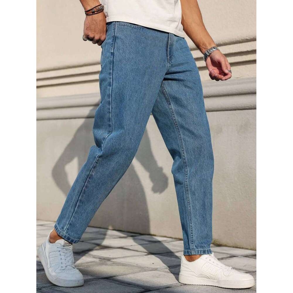 Men's jeans are made of classic blue denim fabric with a loose fit, making them an indispensable versatile item in the wardrobe.
