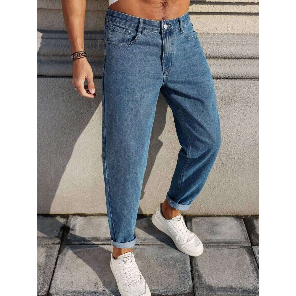 Men's jeans are made of classic blue denim fabric with a loose fit, making them an indispensable versatile item in the wardrobe.