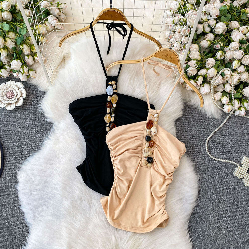 Designer European and American niche pearl jewelry suspender women's a22 2026 summer new item pleated waist slimming short for outerwear