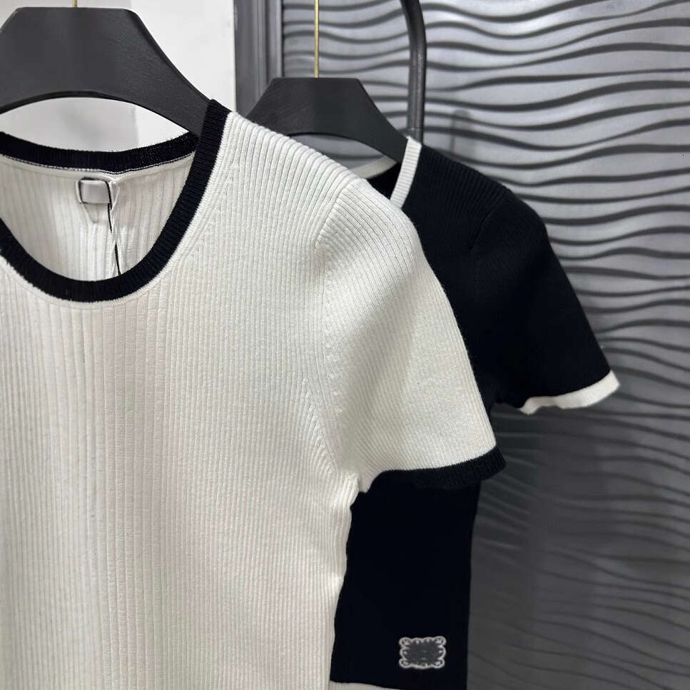 Xiaoxiangfeng style high-end women's clothing 2026 summer new item hollow short A15 sleeved color blocked round neck knitted contrast top