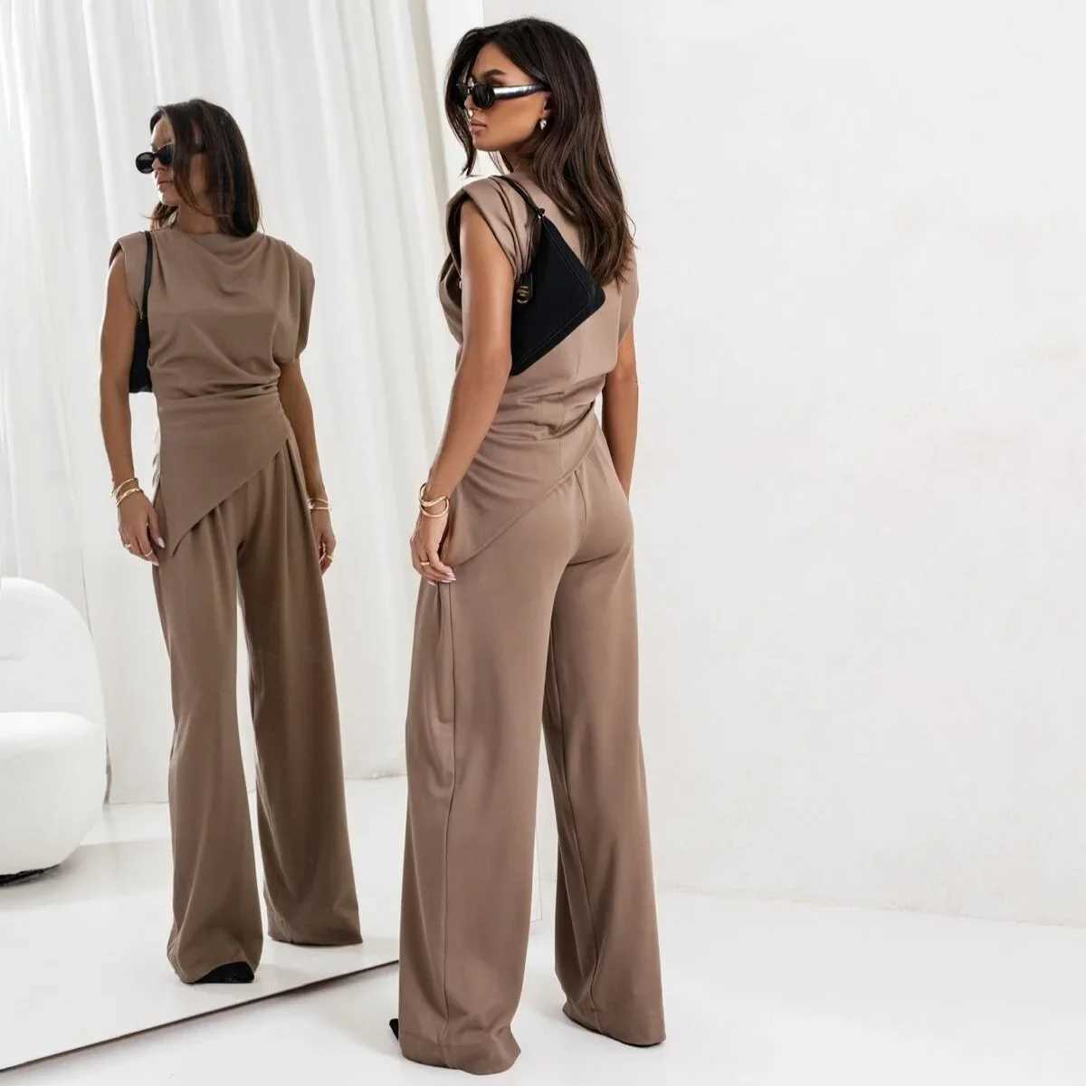 womens clothing set in Europe and America featuring solid colors irregular short-sleeved shirts and loose trousers M260313