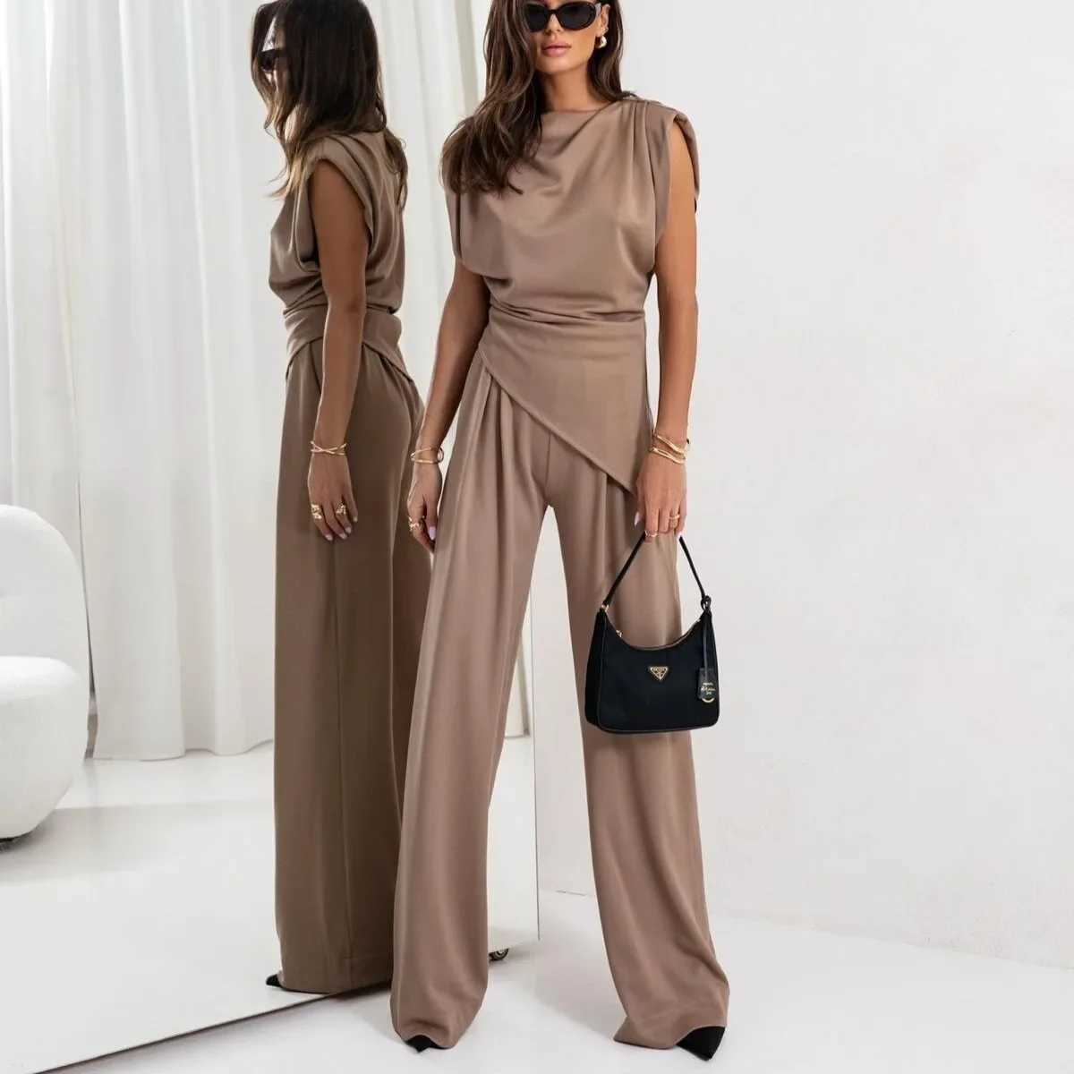 womens clothing set in Europe and America featuring solid colors irregular short-sleeved shirts and loose trousers M260313