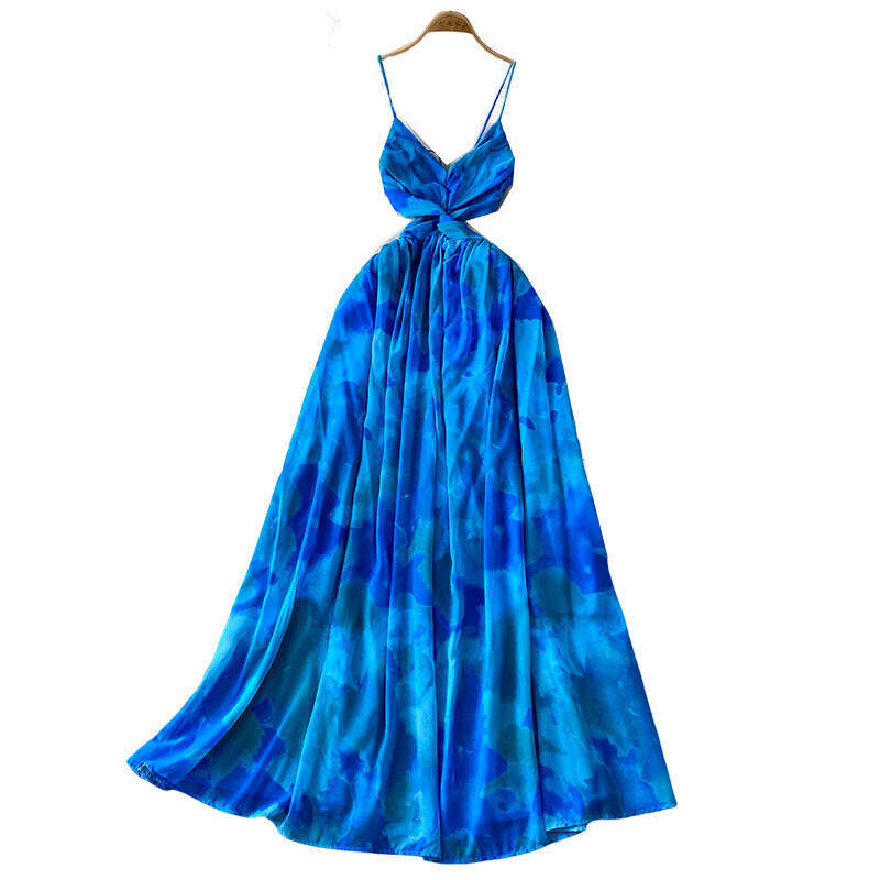 Seaside vacation style beach skirt with feminine design featuring cross twisted details, waist and shoulder straps, and a large hem